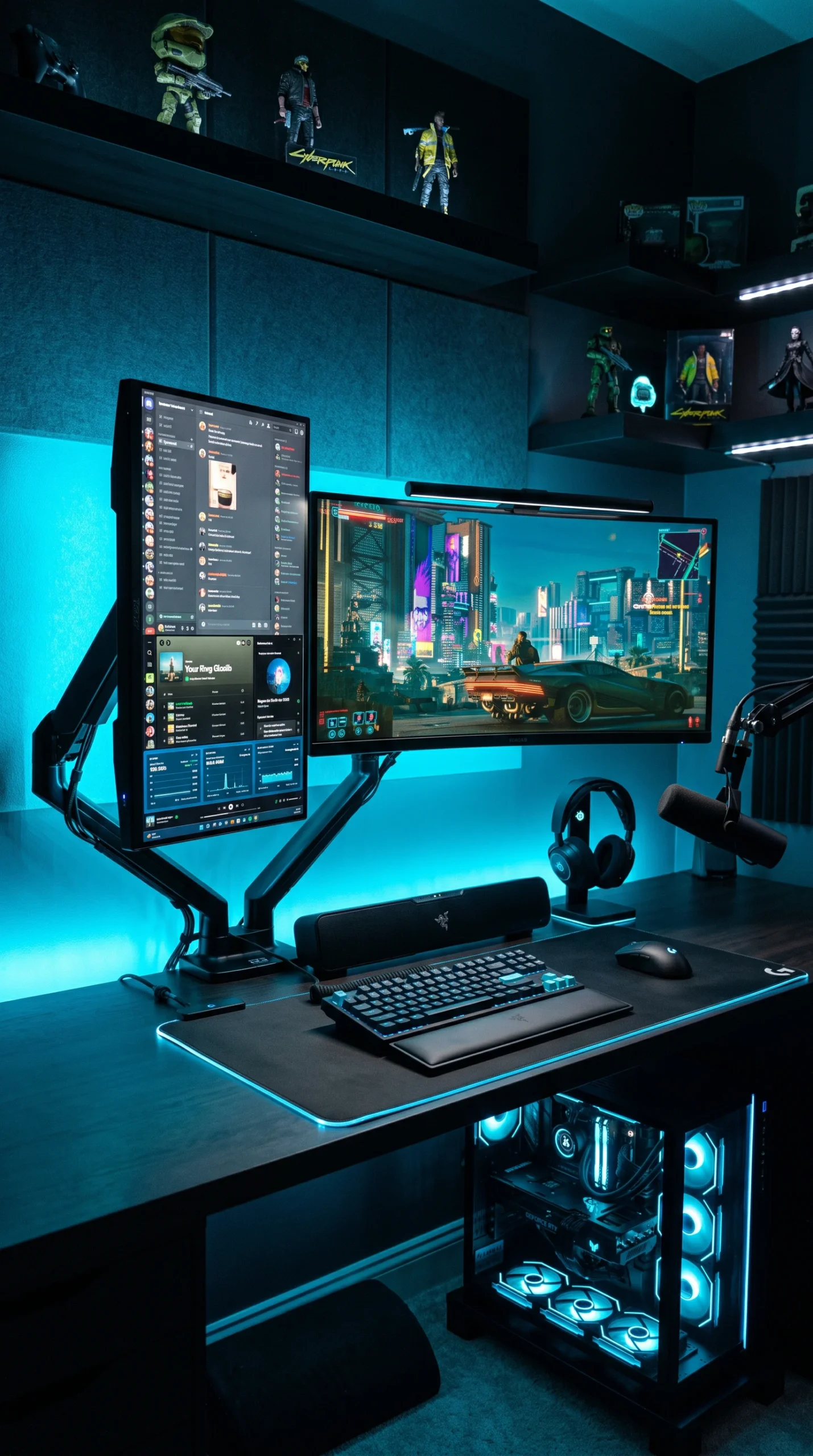 Vertical shot of a black desk with a dual monitor setup (one horizontal, one vertical on the left) glowing with bright blue neon backlighting.
